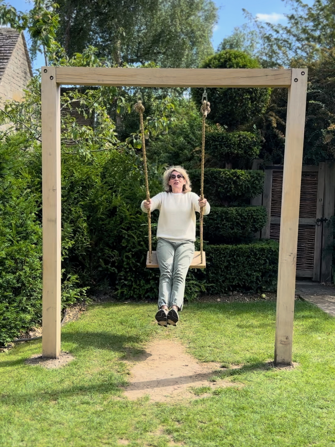 Jeanette Swinging on a medium size swing on a swing frame