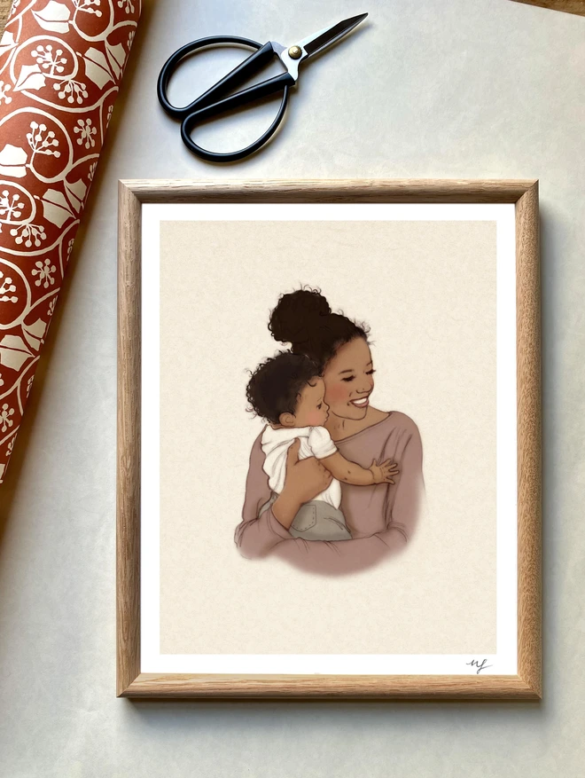 a photo of a framed art print of a black mother hugging her baby. hand drawn in a vintage childrens book style and framed in a retro oak frame