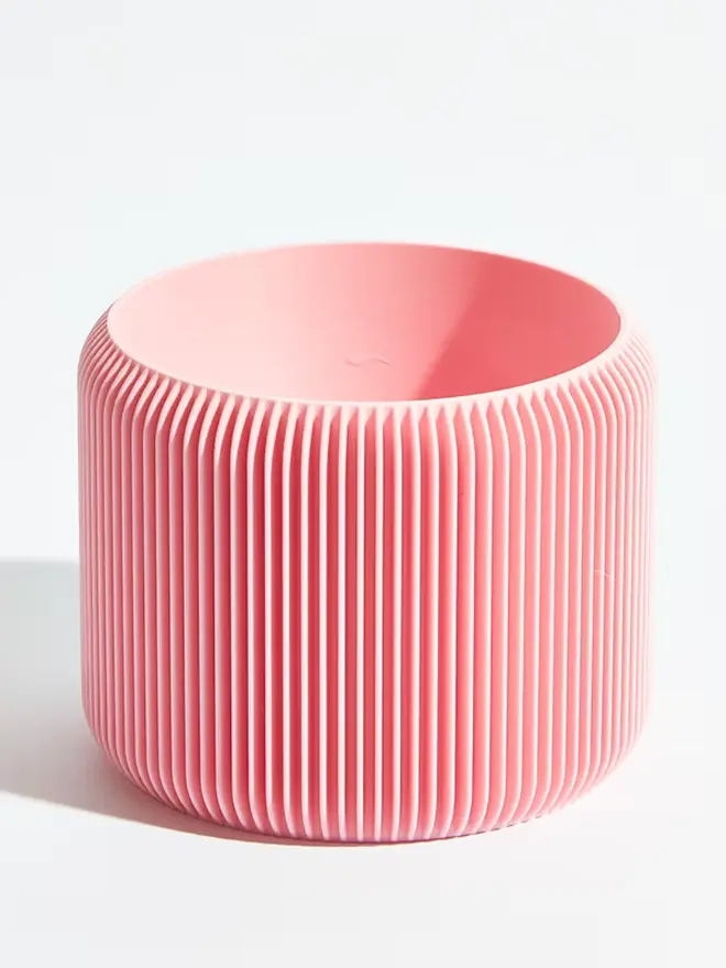 Sustainable 3D Printed Sakura Pink Plant Pot, turbin design against a white background.  