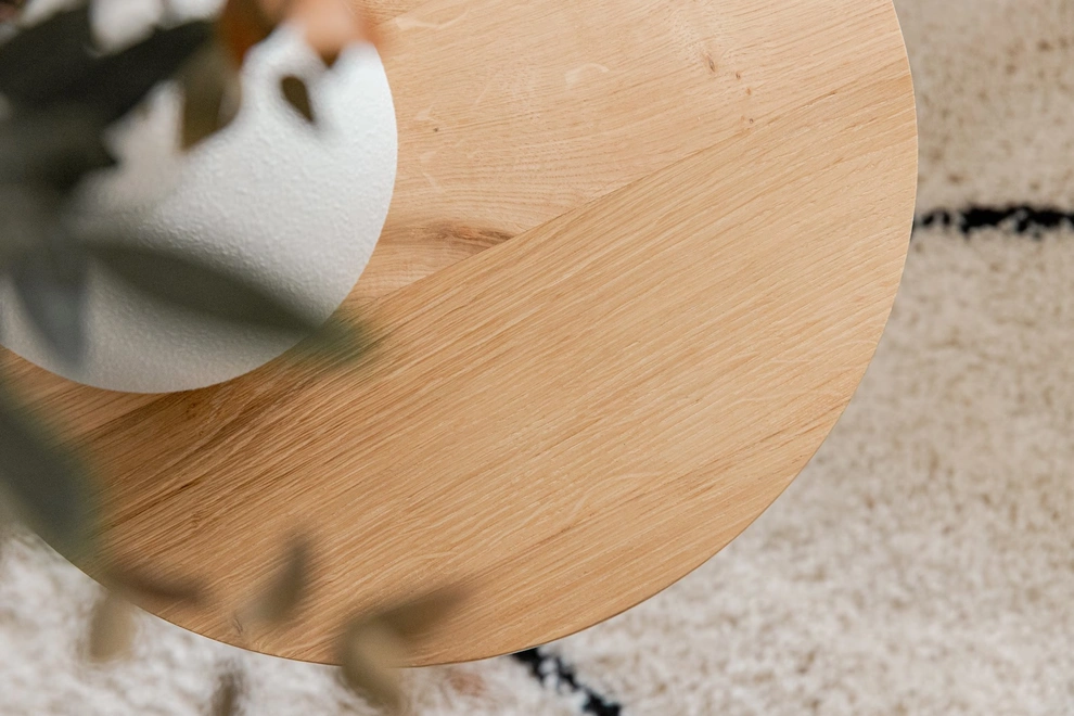Handmade Solid Oak Side Table, a wooden side table sitting on a carpet in a living room. It is accompanied by a vase.