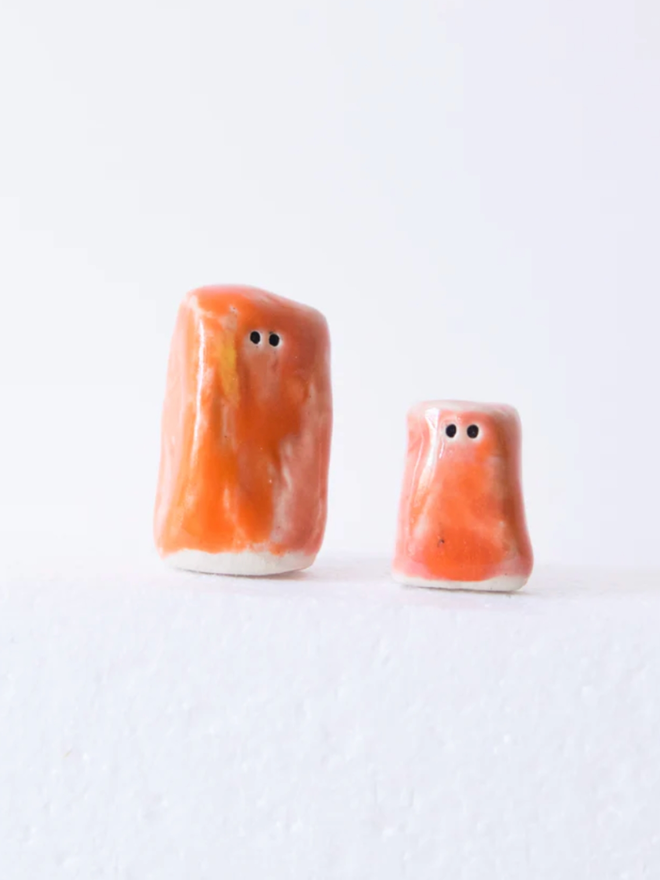 Wee Guys. Two wee guys in orange.