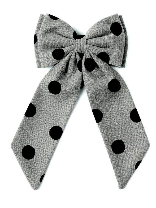 Over Sized Linen Polka Dot Bow Hanging Christmas Decoration, black polka dot bow placed in front of a white background. 