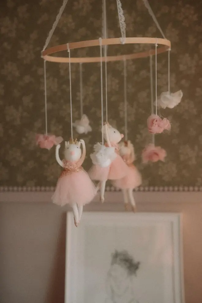 Hanging Mice Ballerina Felt Carousel Decoration, a hanging mice carousel decoration suspended in a child's decorated bedroom. 