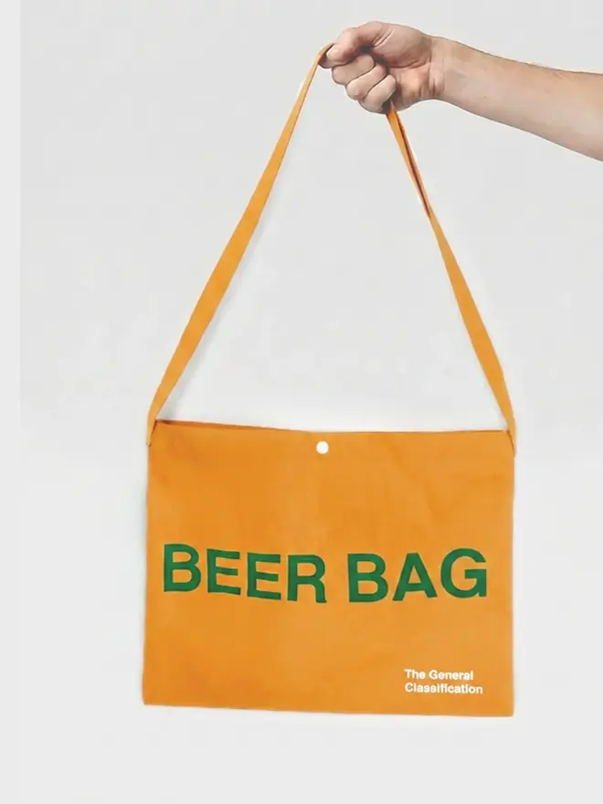 'Beer Bag' Musette Bag, against a grey background. 