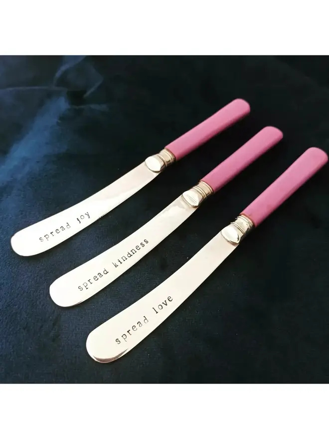 Pink bakelite spread knives