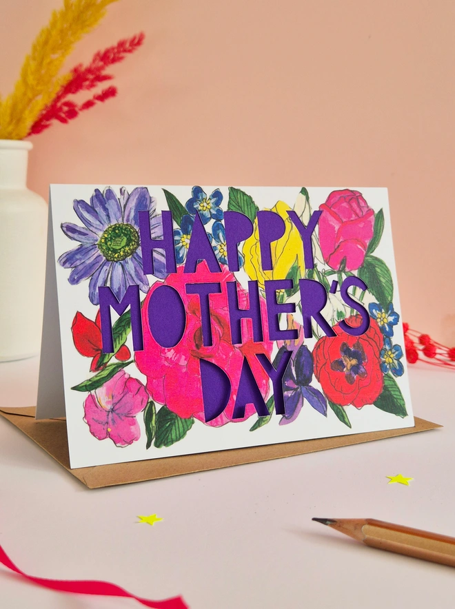 Bright floral illustration with Happy Mother's Day text and bright purple liner 