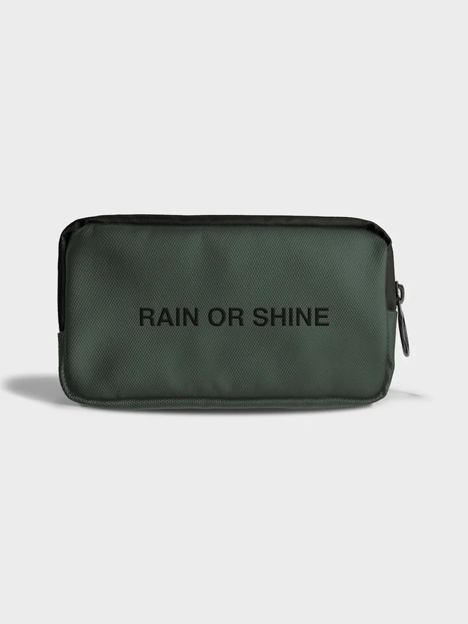 green case with 'rain or shine' text on white surface