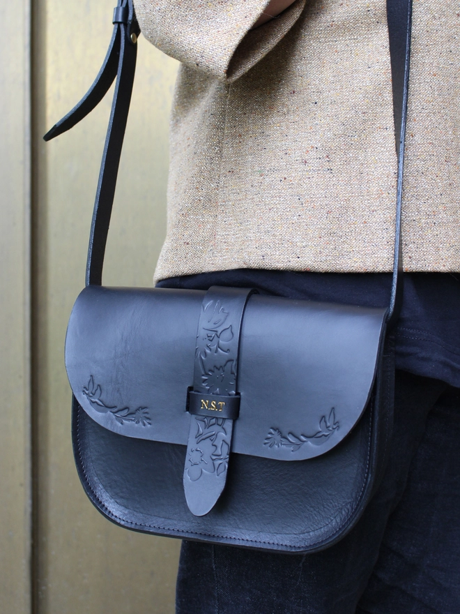 a black vegetable tanned Italian leather shoulder bag personalised with gold initials
