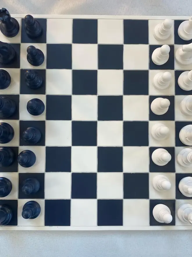 Handmade Jesmonite Chess Board, a handmade colourful chess board sitting on a white surface. 