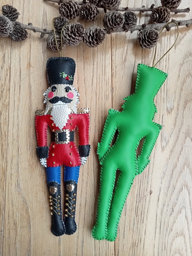 Hetty and Dave leatherette nutcracker decorations. One is green, the other red