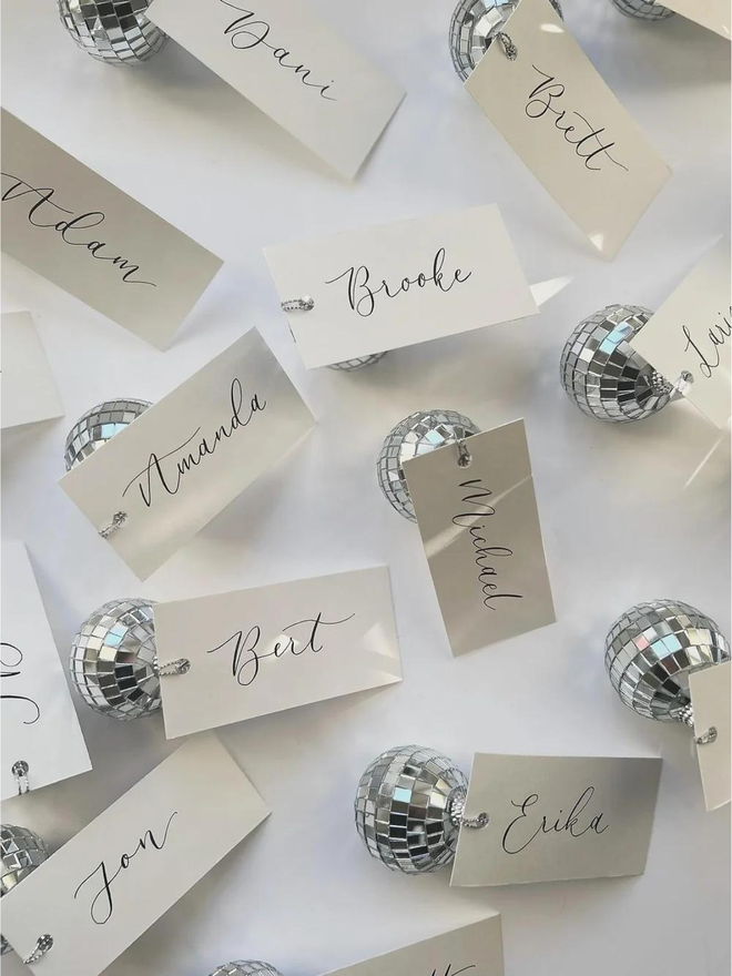 handwritten calligraphy disco ball wedding place card settings