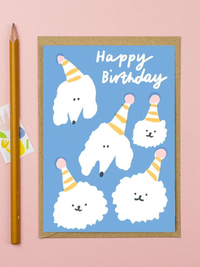 Happy birthday card featuring poodles in party hats 