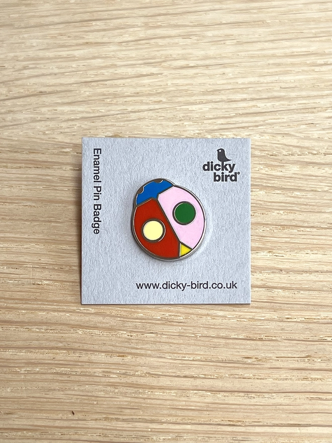 Colourful enamel ladybird pin badge