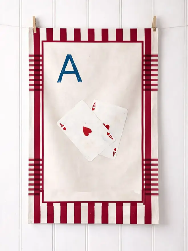a-z alphabet tea towel. a tea towel with an ace of spades card print and the letter 'a' in the corner.