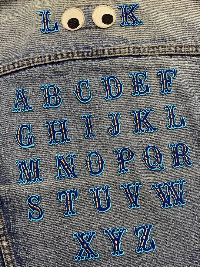 Blue alphabet iron on embroidered patch for personalising accessories and clothes.