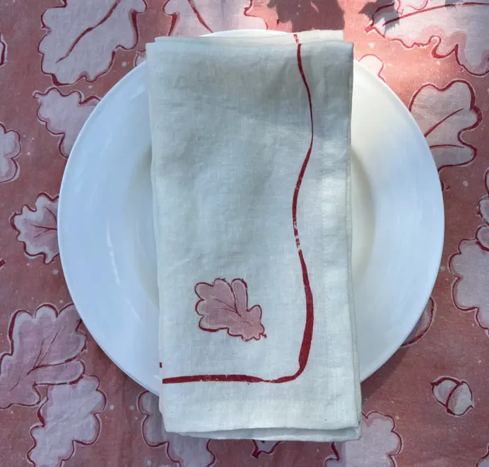 Oak Leaf Napkins (Set of 4). Light cloth napkin, folded on a light pink table cloth, 