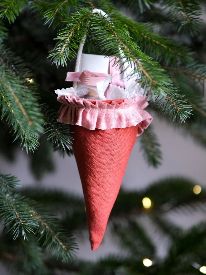 Reusable Victorian Christmas gift cones for hanging beneath festive greenery, featuring delicate ruffled trim.