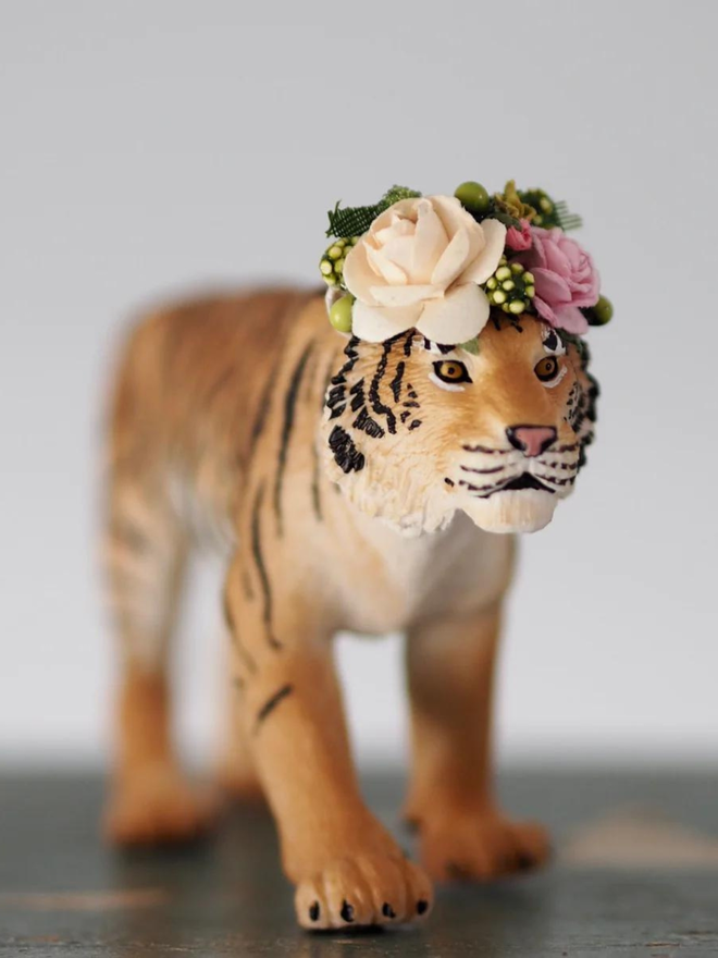 Tiger seen with a floral headdress.