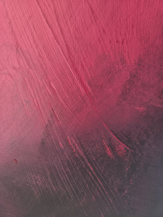 Close up of paint finish of painted vintage wooden cabinet with pink, blue and floral decoration