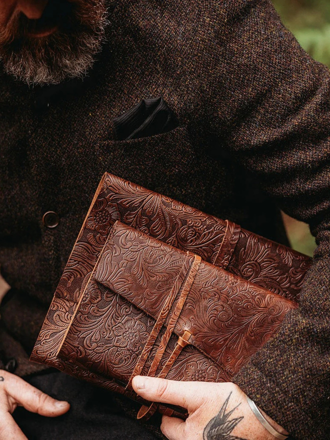 a5 medium leather journal. two brown floral leather bound journals