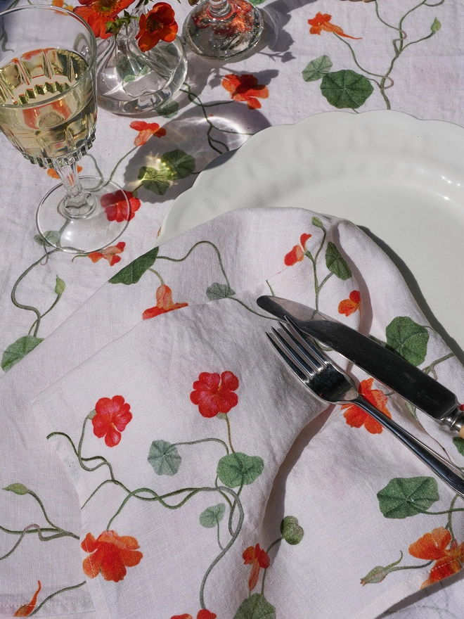 tablescape with linens printed with nasturtiums