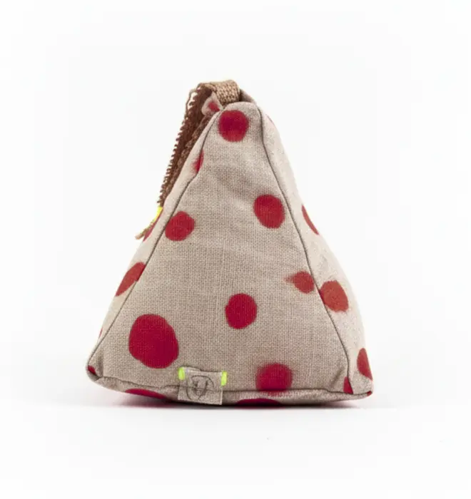 Hand Painted Linen Sustainable Doorstop In Polka Dot Print, a muted burgandy doorstop against a white background. 
