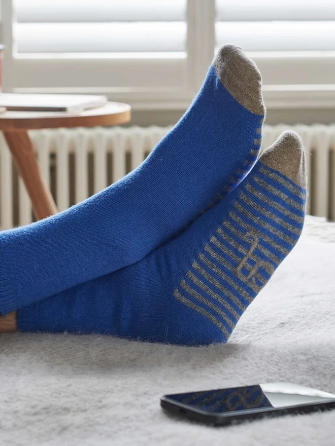 Men's Organic Cotten Striped Arch Ankle Socks, a man wearing a pair of colourful socks. 