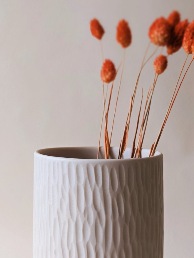 handmade textured oat coloured vase with dried flowers