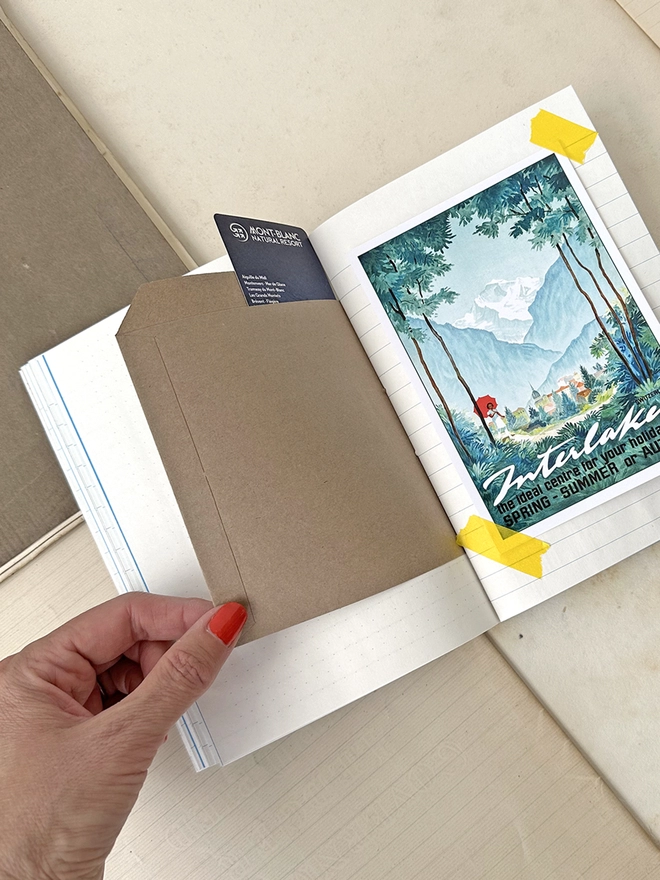 Inside pages of the travel journal showing kraft envelopes