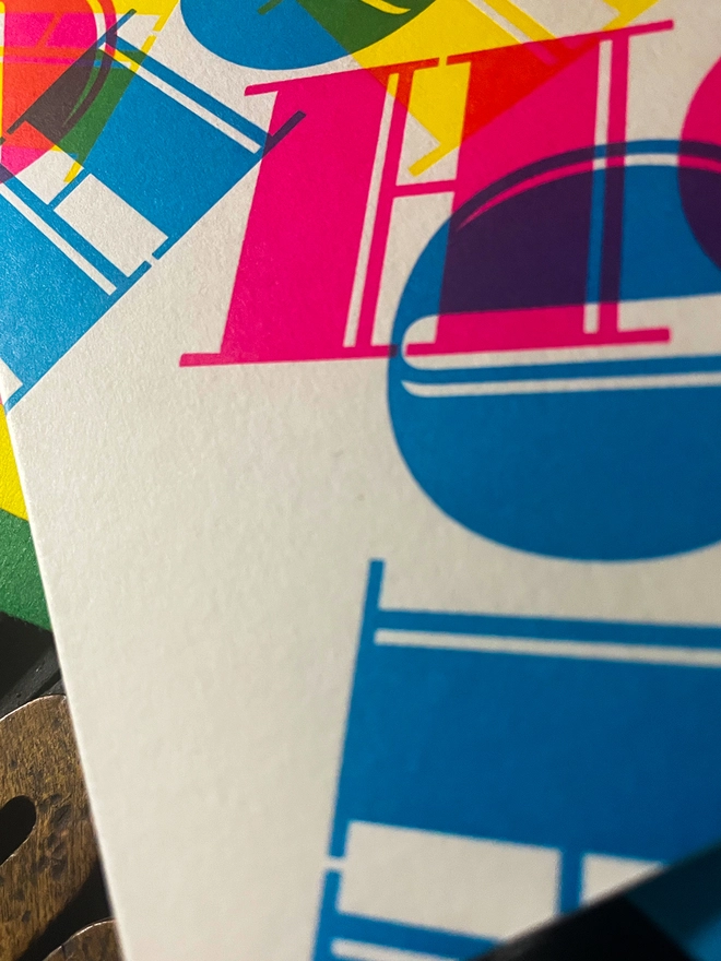 Ho Ho Ho! A beautiful typographic letterpress Christmas card. Printed with rich vibrant and fluorescent blue, magenta and yellow inks with luxury matching and contrasting envelopes; ideal to send to your designer friends at the festive season.