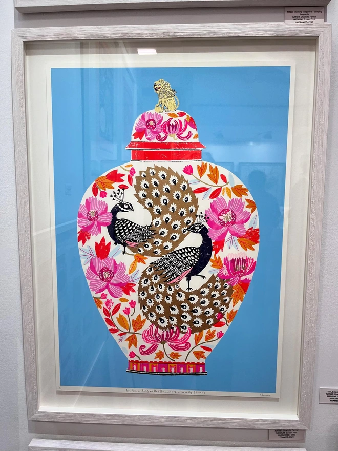 Peacock Vase Are You Looking At Me (You Probably Should), a colourful vase design on a blue screenprint framed. 