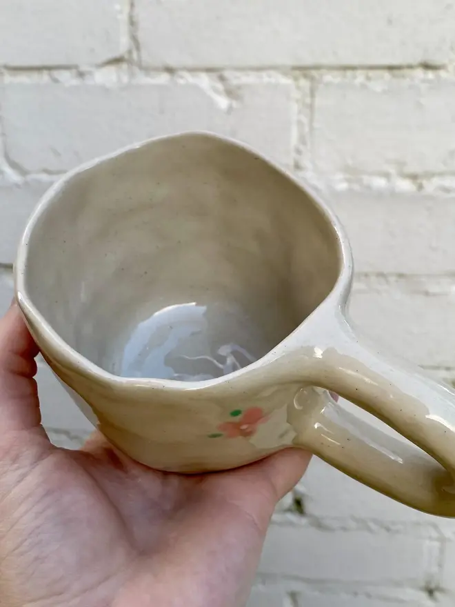 pink flower painted handmade ceramic smiley face mug