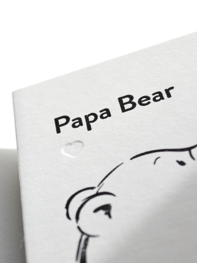 close up of greeting card for Dad details. Papa Bear wording and blind debossed heart.