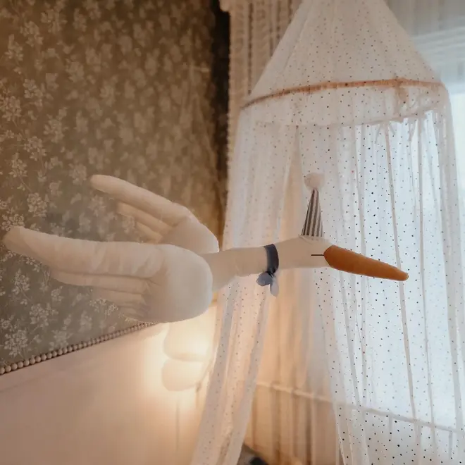 Circus Swan Hanging Decoration, a hanging swan decoration suspended in a child's bedroom. 