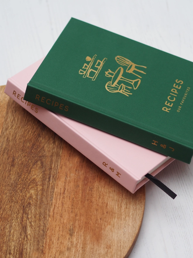 personalised hardcover notebook saying "recipes" "our favourites" in gold foil and with personalised text down the spine