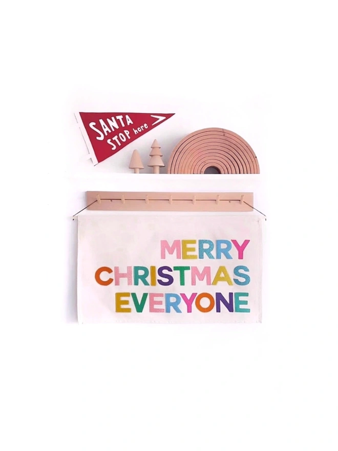 Handmade “Merry Christmas Everyone” banner in pop colours. Felt & organic cotton wall hanging – perfect for spreading festive cheer at home.