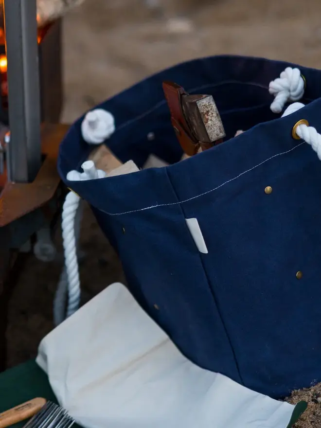 'the henley' canvas picnic bag. a canvas bag photographed open to show picnicware inside.