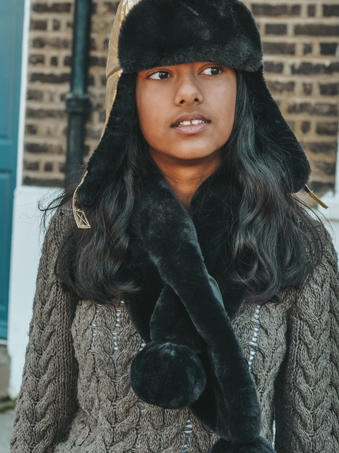 Girl wearing winter faux fur scarf black