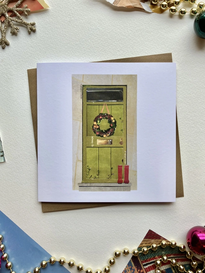 green door christmas card with red wellies