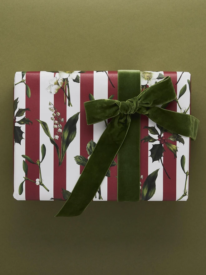 red and ivory stripe pattern with festive botanicals wrapping paper