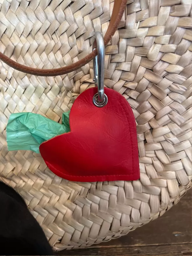 Red Leather Poo Bag Pouch on a woven bag