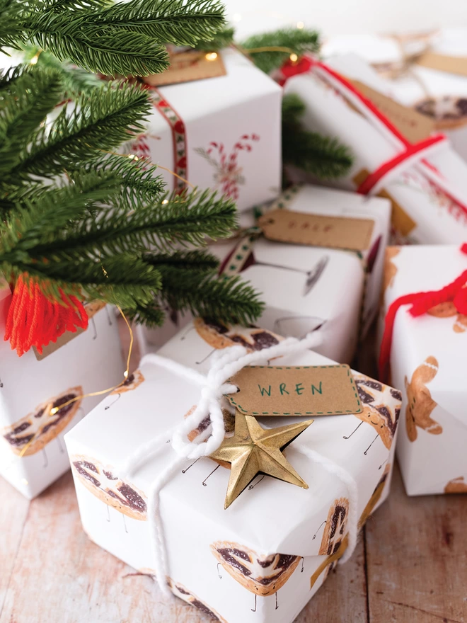 Wrapped Christmas Gifts under a Christmas Tree 