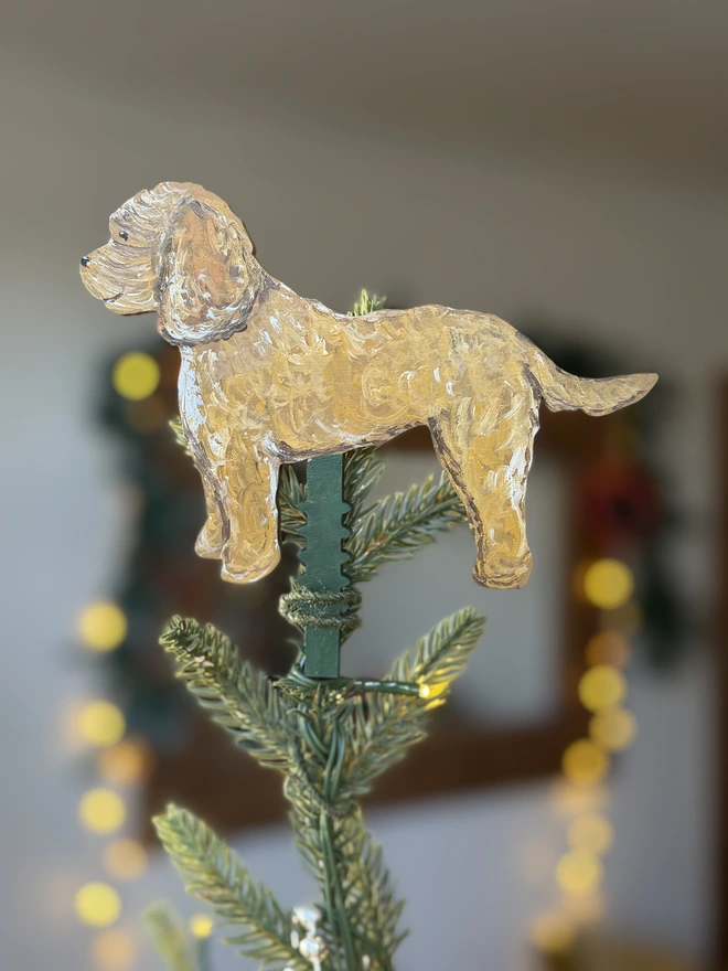 Cockapoo Hand-Painted Dog Christmas Tree Topper Shown at the Top of a Christmas Tree 