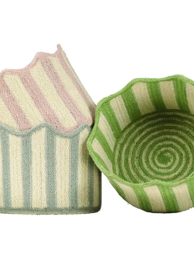 Blueberry stripy scalloped organic jute basket on a white background along side dusty pink and green baskets.