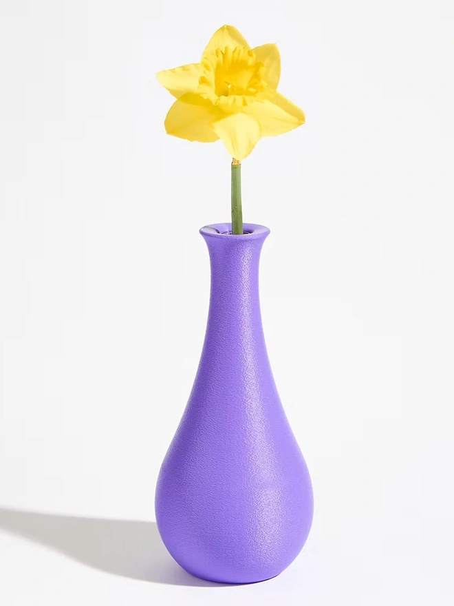 purple 3d printed vase in tear drop shape with yellow flower