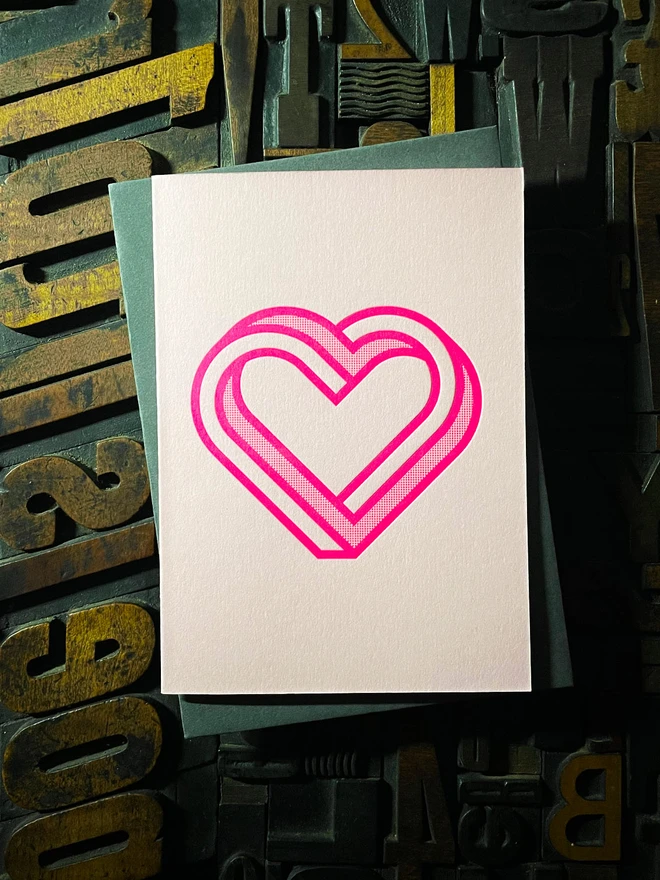 Valentine! A beautiful infinity heart monogram letterpress card printed with rich fluorescent pink ink on thick Candy Pink card with a luxury matching envelope; ideal to send a to a friend or loved one.