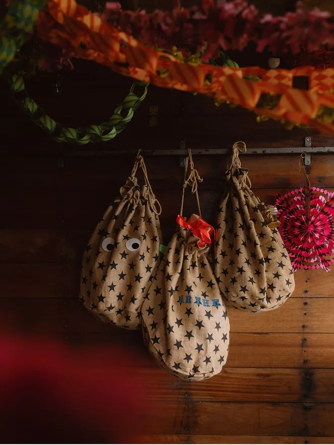 Christmas Star print googly eye sacks full of gifts