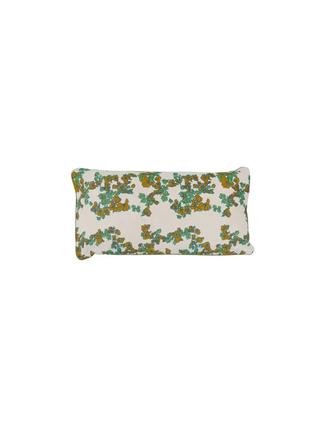 white floral cushion on blank background