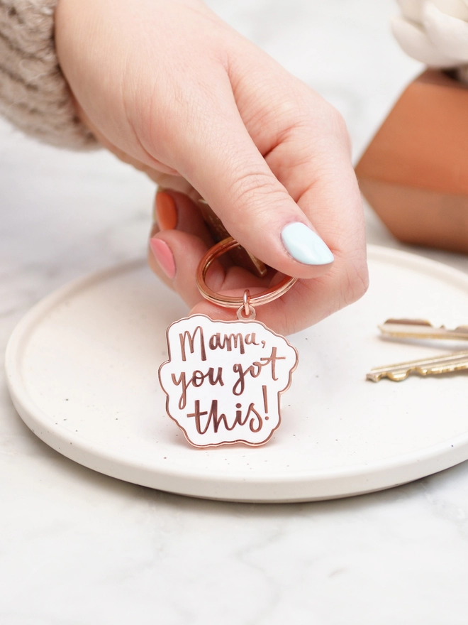 Hand holding the Mama you got this! enamel keyring
