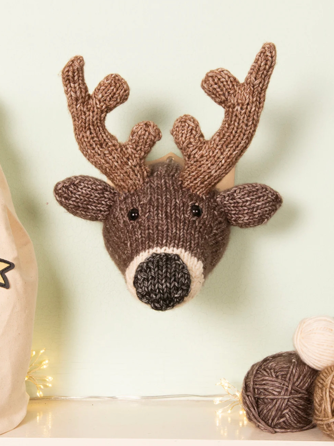 Mini Deer Head Knit Kit. A deer head mounted on a wall.